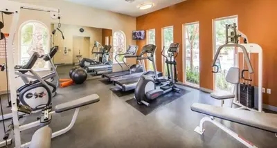 a gym with several treadmills and elliptical machines at Sky Luxury 2BDRM Suite Deluxe Living Cali in Santa Clarita