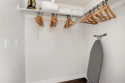 a room with a white wall and a gray tie on a shelf at North Hollywood 1br w roof terrace nr bars LAX-1130 in Los Angeles