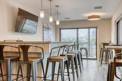 a row of stools at a bar in a restaurant at North Hollywood 1br w roof terrace nr bars LAX-1130 in Los Angeles