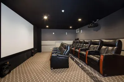 a theater room with leather chairs and a blank screen at North Hollywood 1br w roof terrace nr bars LAX-1130 in Los Angeles