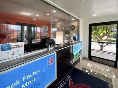 a fast food counter in a restaurant with a window at Studio 6 Suites - Riverside, CA South in Riverside