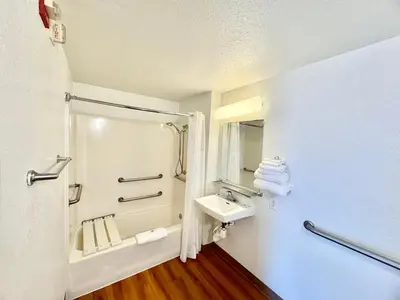 a bathroom with a sink and a shower at Studio 6 Bellflower CA Los Angeles in Bellflower