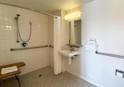 a bathroom with a sink and a shower at Studio 6 Bellflower CA Los Angeles in Bellflower