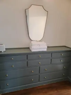 a dresser with a mirror on top of it at Cozy Studio With Franklin Village View - 30 Day Minimum Stay in Los Angeles