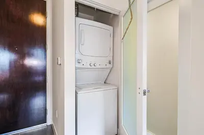 a white washer and dryer in a closet at Sunny & Spacious 2BDR & 1BTH in Downtown LA in Los Angeles