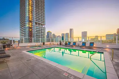a swimming pool on the roof of a building at Sunny & Spacious 2BDR & 1BTH in Downtown LA in Los Angeles