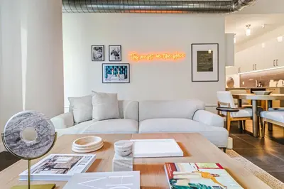 a living room with a couch and a table at Sunny & Spacious 2BDR & 1BTH in Downtown LA in Los Angeles
