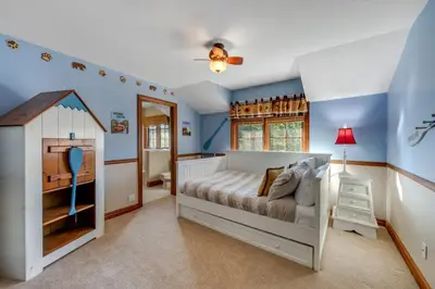 a childs bedroom with a bed and a play house at Mountain Memories on Tavern Bay in Lake Arrowhead
