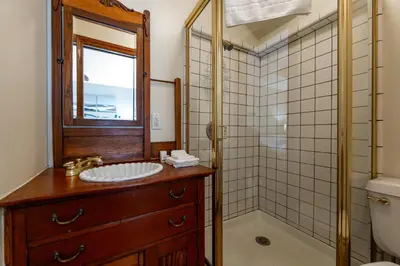 a bathroom with a sink and a shower at Mountain Memories on Tavern Bay in Lake Arrowhead