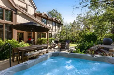 a hot tub in the backyard of a house at Mountain Memories on Tavern Bay in Lake Arrowhead