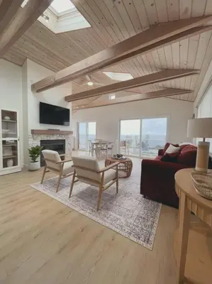 a living room with a couch and a table at Summer Lillie #3 in Summerland