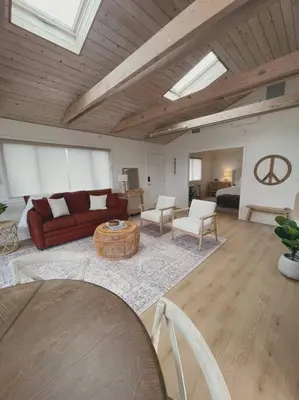 a living room with a couch and a table at Summer Lillie #3 in Summerland