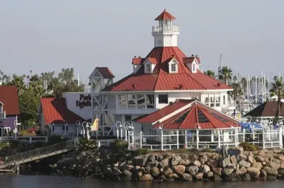 a large white building with a lighthouse on the water at Beautiful Spacious 2 Bedroom, 2 Bathroom Condo in Long Beach
