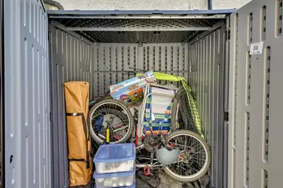 a bike is sitting inside of a garage at Anaheim Hills Retreat - 17 Mi to Disneyland! in Anaheim