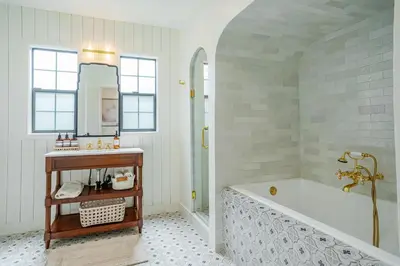 a bathroom with a tub and a sink at Designer 2 bed near Universal sleeps 8 hot tub in Los Angeles