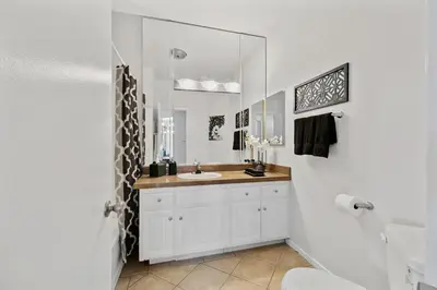 a bathroom with a sink and a mirror at Beverly Hills Glamour Oasis 2 BR Apt with Parking 304 in Los Angeles