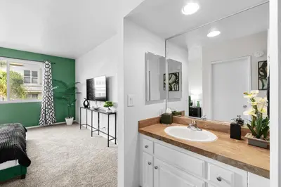 a bathroom with a sink and a mirror at Beverly Hills Glamour Oasis 2 BR Apt with Parking 304 in Los Angeles