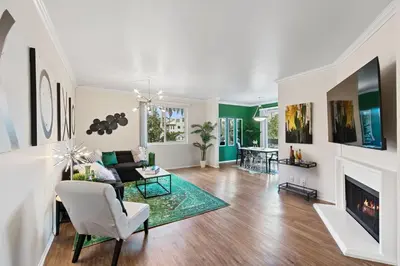 a living room with a couch and a fireplace at Beverly Hills Glamour Oasis 2 BR Apt with Parking 304 in Los Angeles
