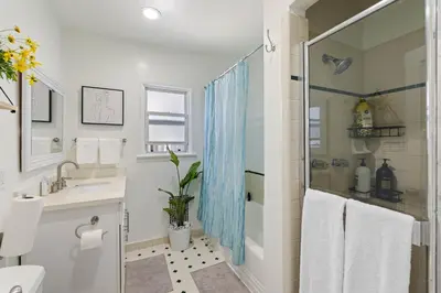 a bathroom with a shower and a sink at 5 Mins Walk To Oldtown Monrovia Cozy 4 Br Home in Monrovia