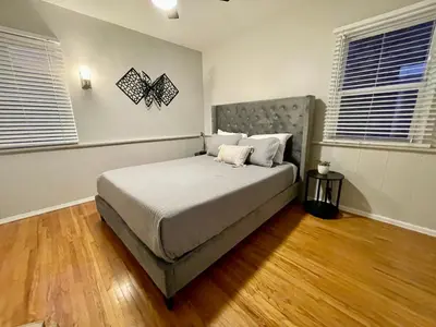 a bedroom with a large bed in a room at 5 Mins Walk To Oldtown Monrovia Cozy 4 Br Home in Monrovia