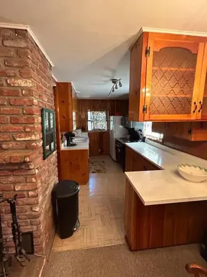 a kitchen with a brick wall and a counter top at Sequoia National Forest CabinD in Panorama Heights