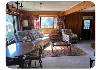 a living room with a couch and a table at Sequoia National Forest CabinD in Panorama Heights
