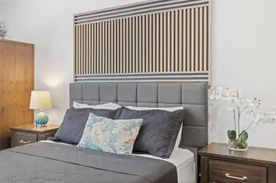 a bedroom with a large bed with two night stands at Central Location Family Size Home in Temple City