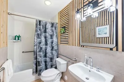 a bathroom with a toilet and a sink at Central Location Family Size Home in Temple City
