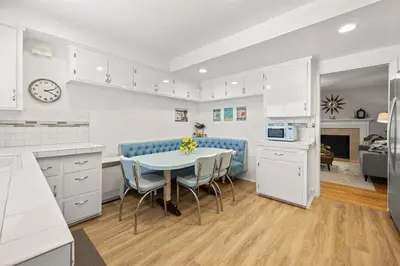 a kitchen and dining room with a table and chairs at Disneyland close FAMILY home! in Fullerton
