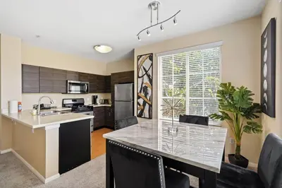 a kitchen with a large island with a counter top at Luxury 2BR/2BA! 5 MIN to Disney! in Anaheim