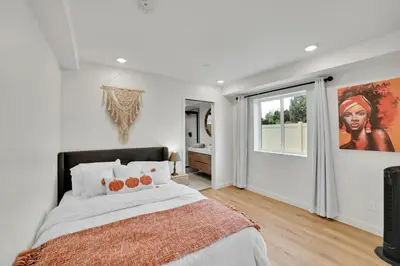 a bedroom with a large bed and a window at Brand new Chic-Nest in Prime Location in Sherman Oaks