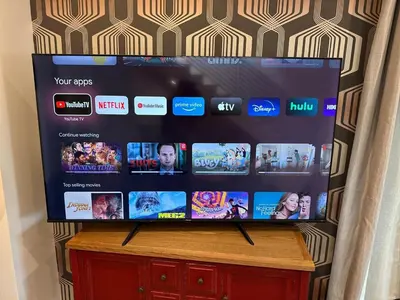 a flat screen tv sitting on top of a wooden table at Brand new Chic-Nest in Prime Location in Sherman Oaks