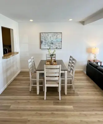 a dining room with a table and chairs at Beachfront Paradise in Port Hueneme