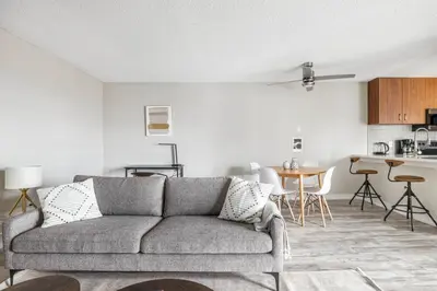 a living room with a couch and a kitchen at Redondo Beach 1BR w Pool Gym 1 block from beach LAX-438 in Redondo Beach