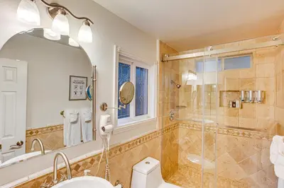 a bathroom with a shower and a toilet at 1 Mi to Lake Arrowhead Village! Cabin with Game Room in Lake Arrowhead