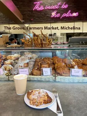a bakery with a plate of pastries in a window at Hollywood Guesthouse in Los Angeles