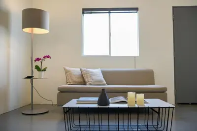 a living room with a couch and a table at Hollywood Guesthouse in Los Angeles