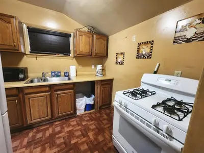 a kitchen with a stove and a sink at Creek Runner's Lodge in Big Bear Lake