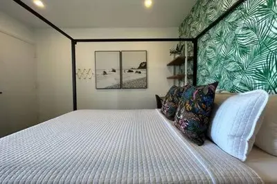 a bedroom with a large bed in a room at Ocean View Studio Manhattan Beach in Manhattan Beach