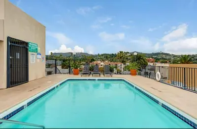 a swimming pool with a view of a building at Hollywood Apartments Mario & No Themed With Pool FREE parking and WIFI in Los Angeles