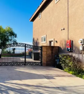 a gate in front of a building with a driveway at Private-room-Private-entrance-spectacular-city-landscape-views-from-room in Rancho Cucamonga