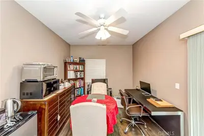 an office with a desk with a computer and a ceiling fan at Redondo Beach Suite, 2 BR 1st floor Surf Gym workspace in Redondo Beach