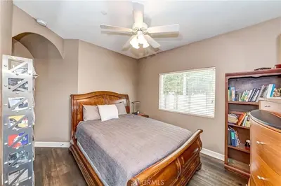 a bedroom with a bed and a ceiling fan at Redondo Beach Suite, 2 BR 1st floor Surf Gym workspace in Redondo Beach