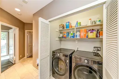 a laundry room with a washer and dryer at Redondo Beach Suite, 2 BR 1st floor Surf Gym workspace in Redondo Beach
