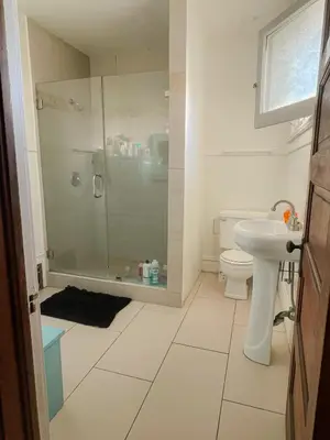 a bathroom with a shower and a toilet and a sink at Lovely Home at Westminster in Westminster