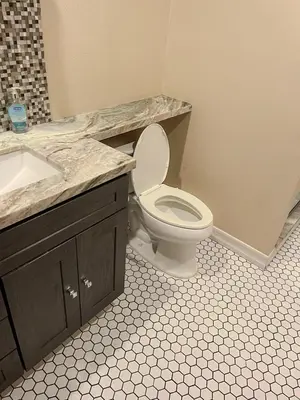 a bathroom with a white toilet and a sink at Lovely Home at Westminster in Westminster