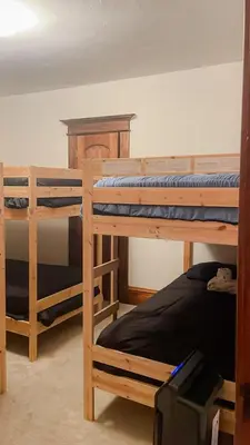 two bunk beds in a room with a bed at Lovely Home at Westminster in Westminster