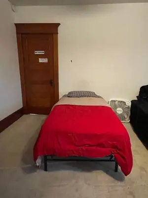 a bedroom with a bed with a red blanket at Lovely Home at Westminster in Westminster