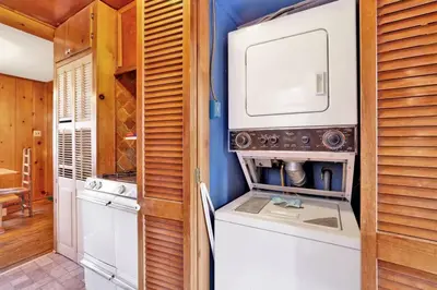 a kitchen with a washer and dryer in a house at Temple Lake Views Walk To Marina & Village Cabin in Big Bear Lake