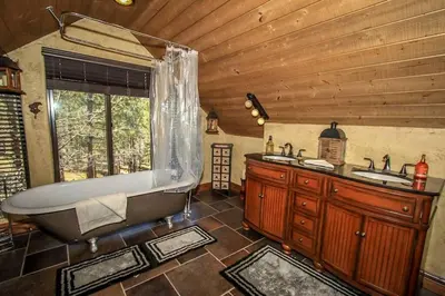 a large bathroom with a tub and a sink at How Sweet It Is~ Downtown Village Retreat Cabin~ Walk to Marinas and Shopping in Big Bear Lake